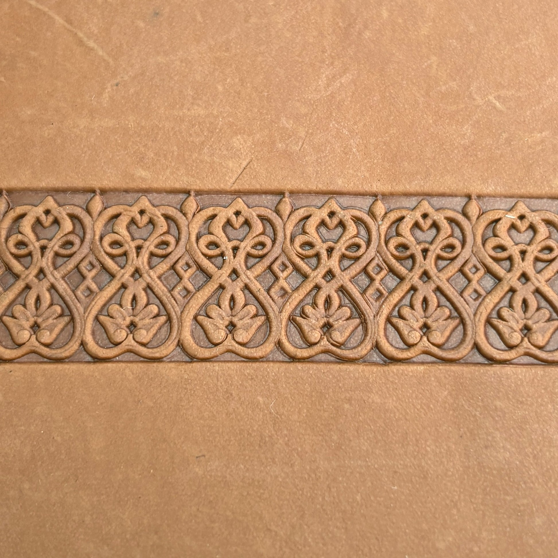 Floral Loop leather stamp LT108 — pattern imprint on veg-tan leather