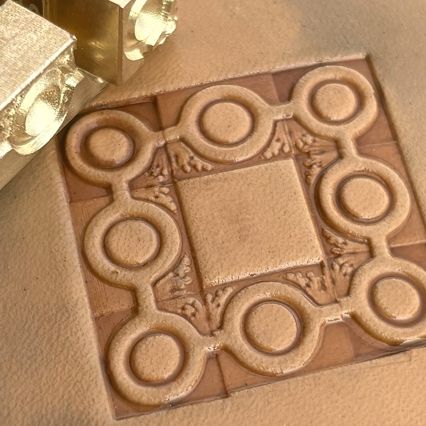 Geometric leather stamp LT111 — brass stamping tool with imprint on natural veg-tan leather