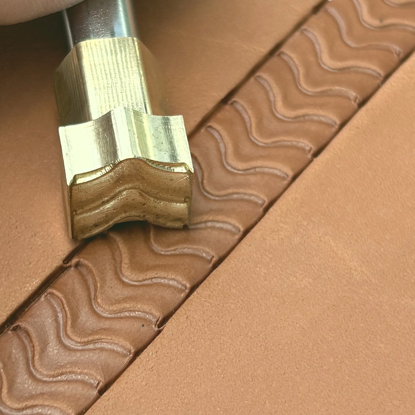 Wavy Line leather stamp LT116 — brass stamping tool with imprint on natural veg-tan leather