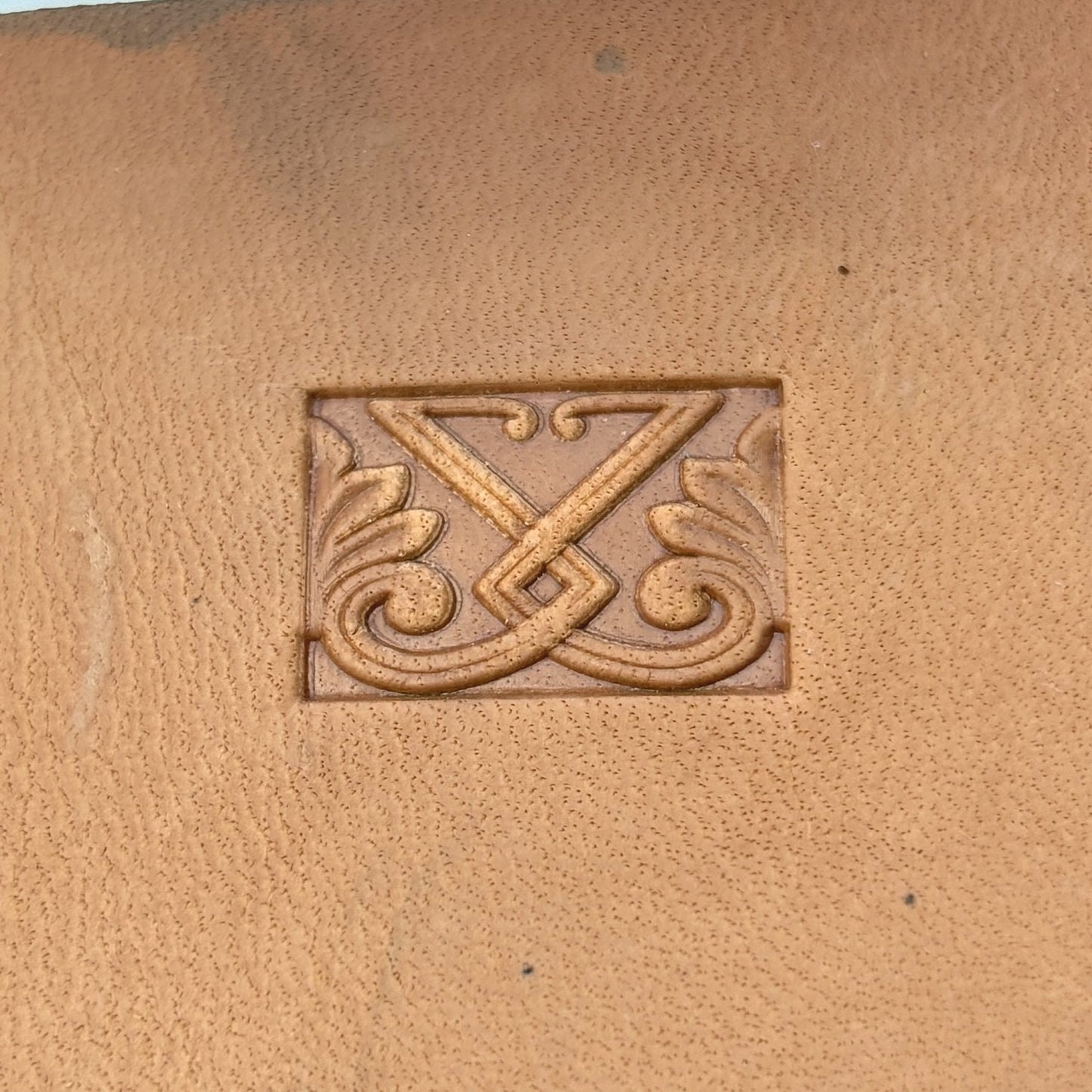 Ornate Shape leather stamp LT117 — single impression on veg-tan leather