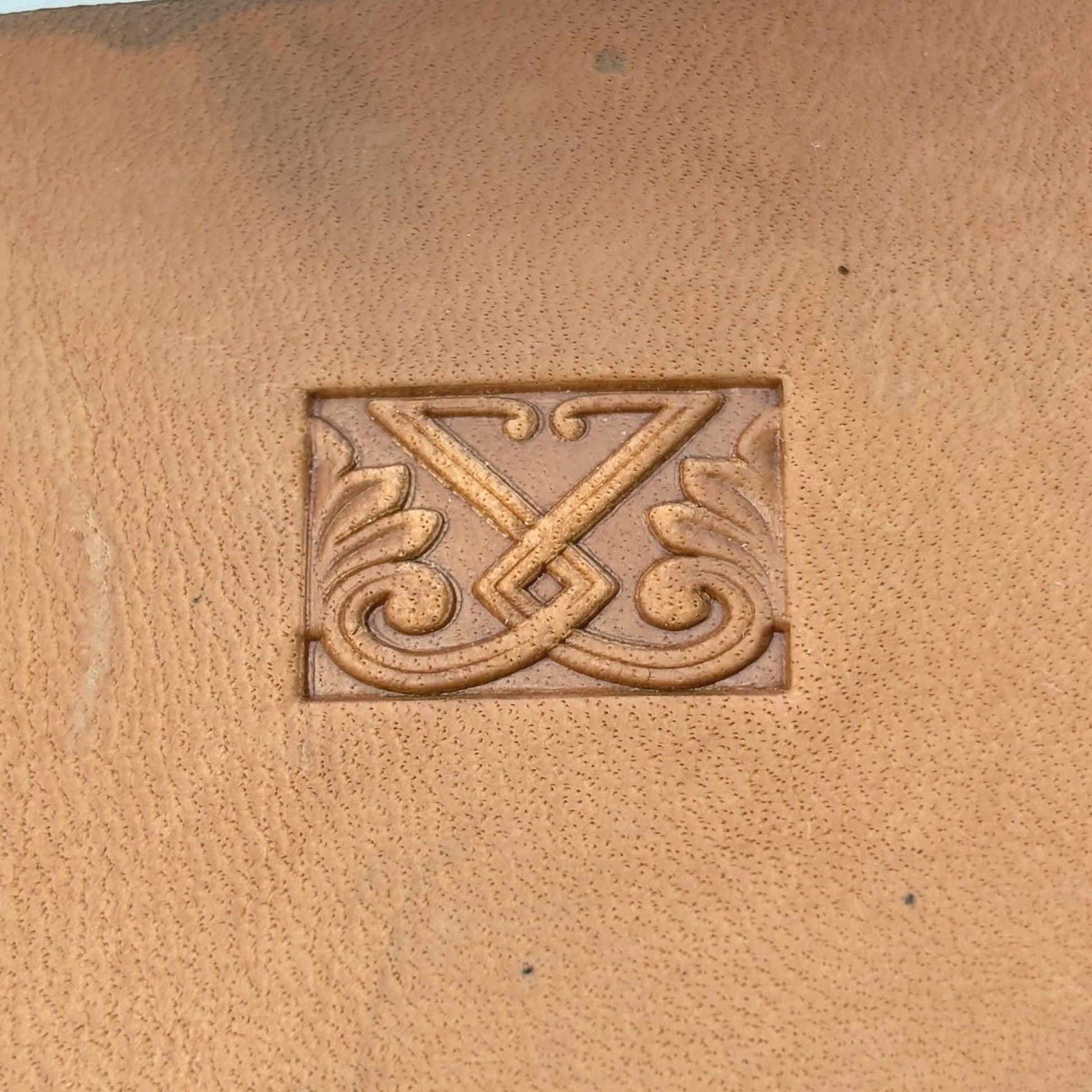Ornate Shape leather stamp LT117 — single impression on veg-tan leather