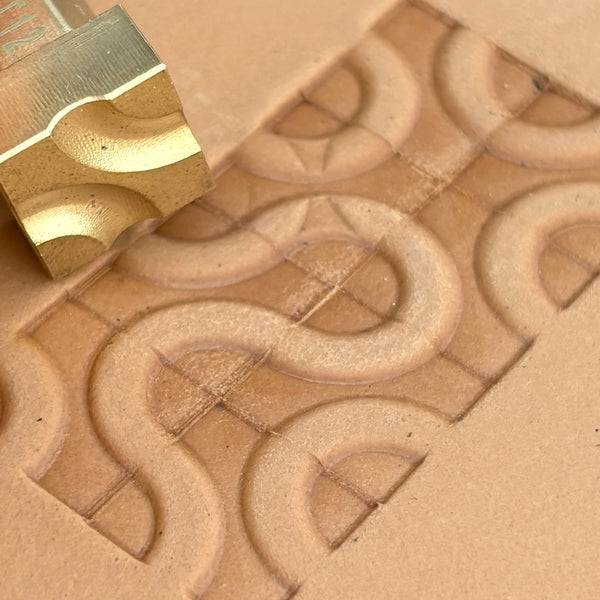Geometric leather stamp LT122 — brass stamping tool with imprint on natural veg-tan leather