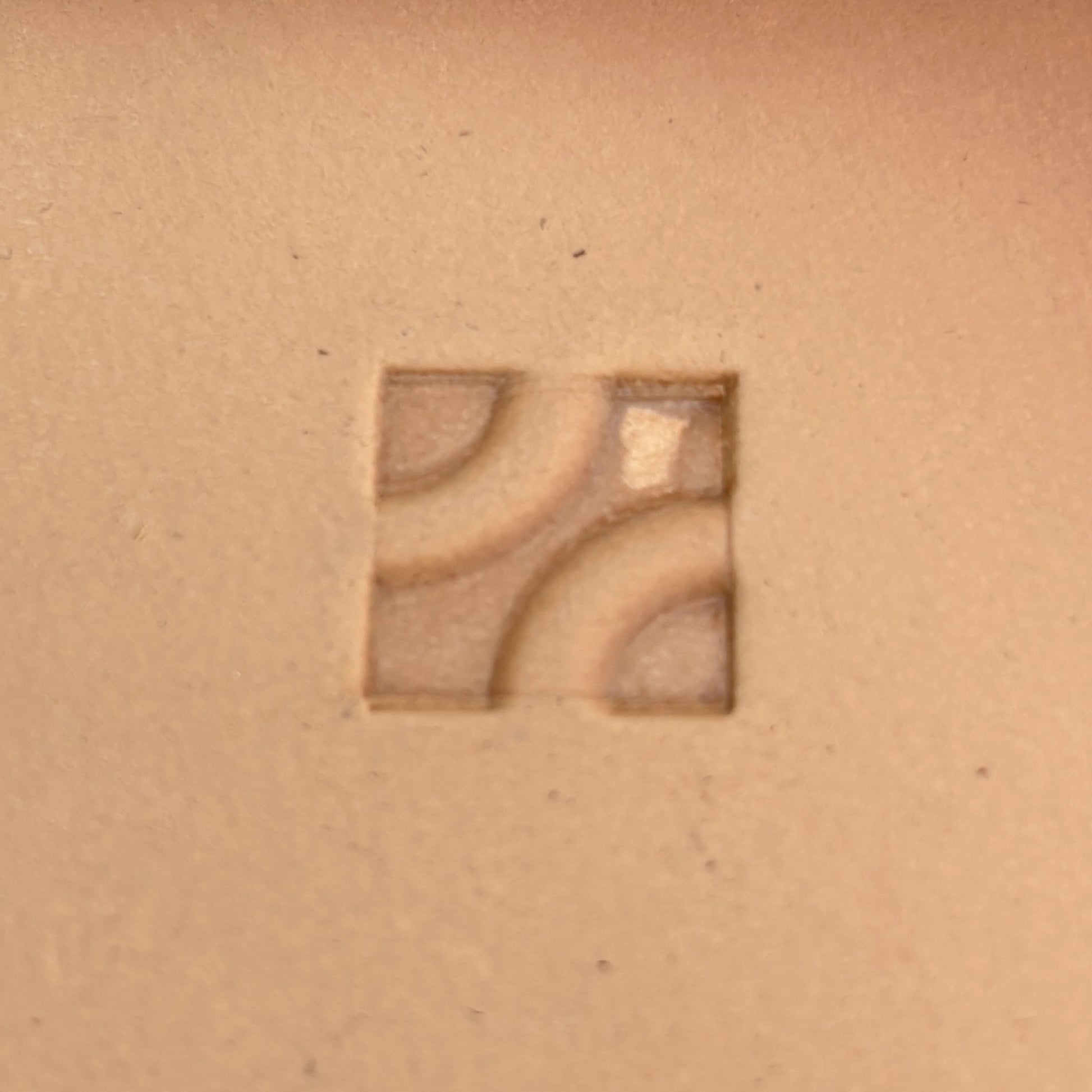 Geometric leather stamp LT122 — single impression on veg-tan leather