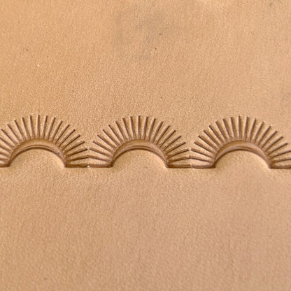 Sunburst Border leather stamp LT124 — single impression on veg-tan leather