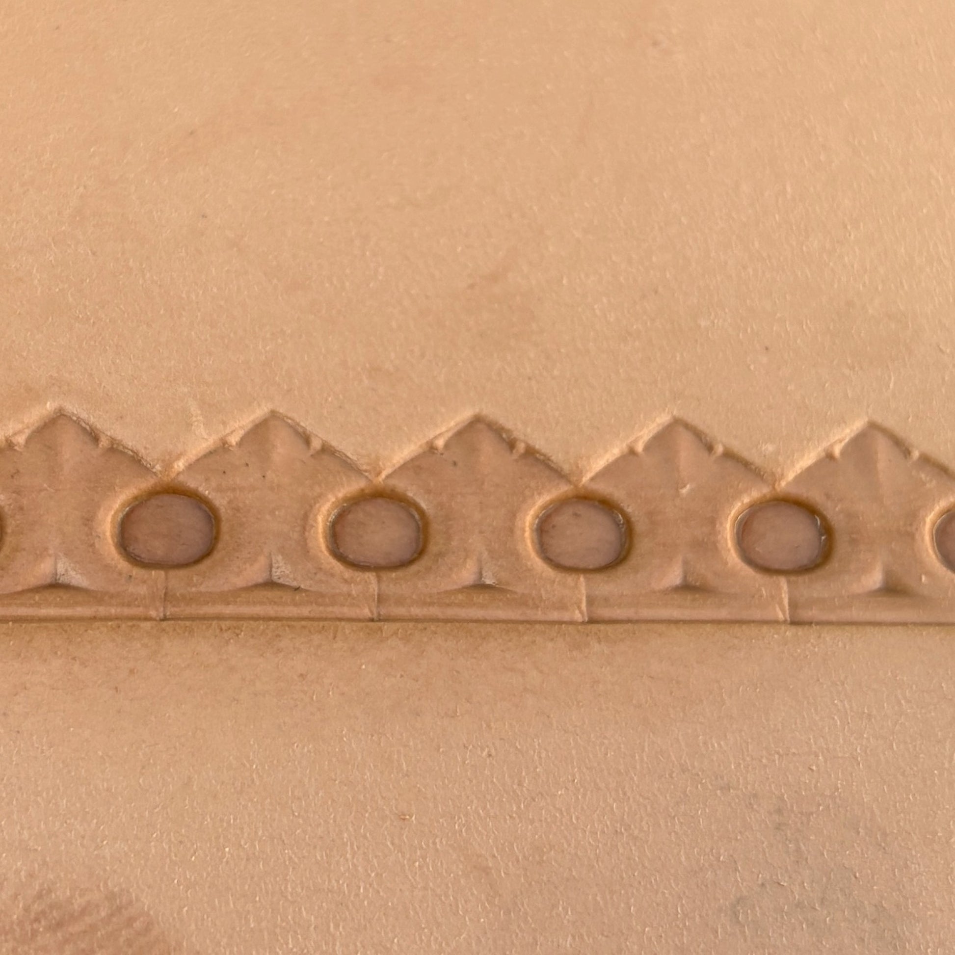 Circle Border leather stamp LT126 — imprint on natural veg-tan leather