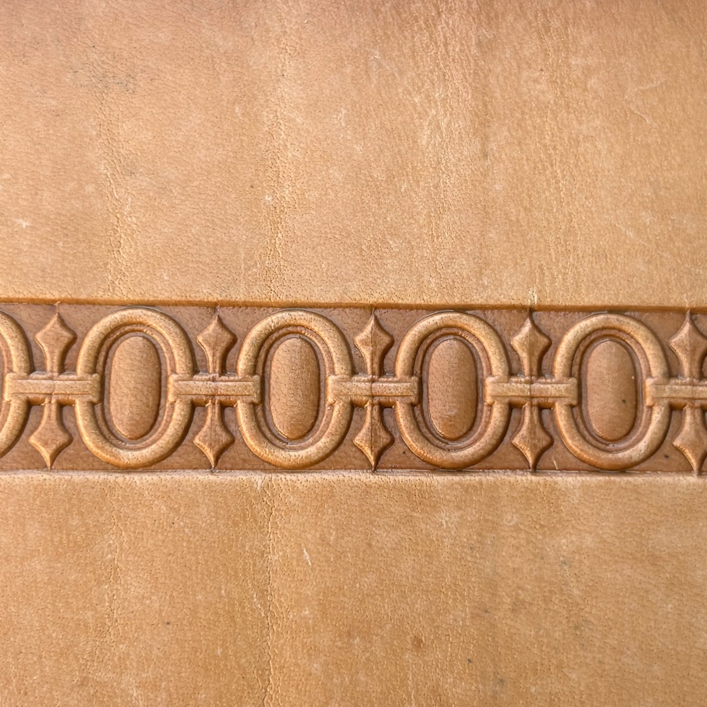 Geometric leather stamp LT127 — brass stamping tool with imprint on natural veg-tan leather