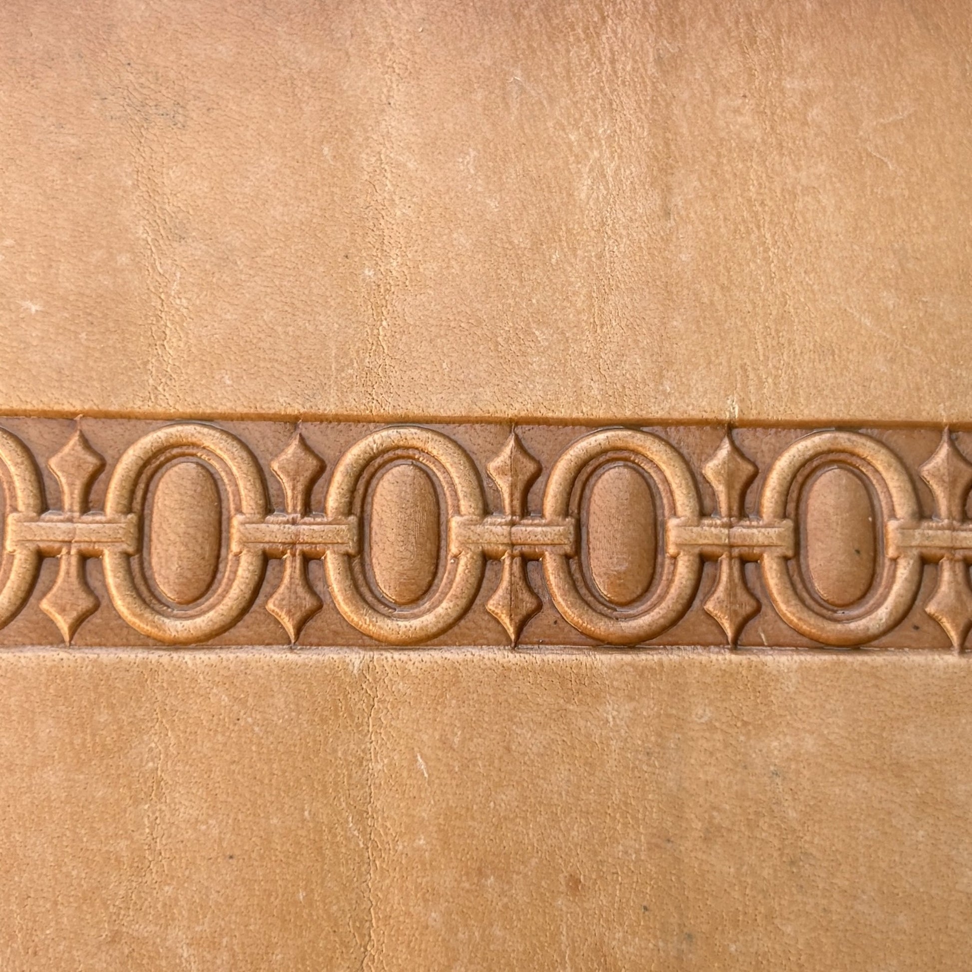 Geometric leather stamp LT127 — brass stamping tool with imprint on natural veg-tan leather
