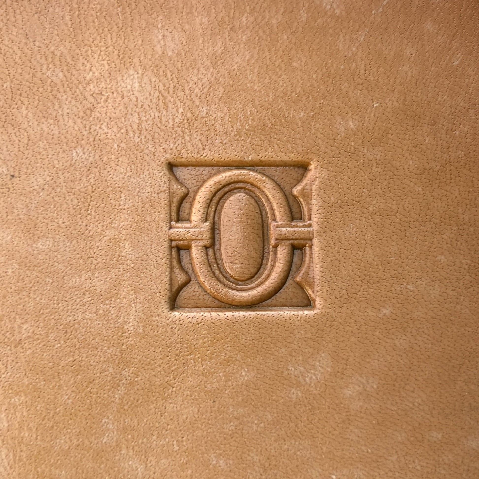 Geometric leather stamp LT127 — single impression on veg-tan leather