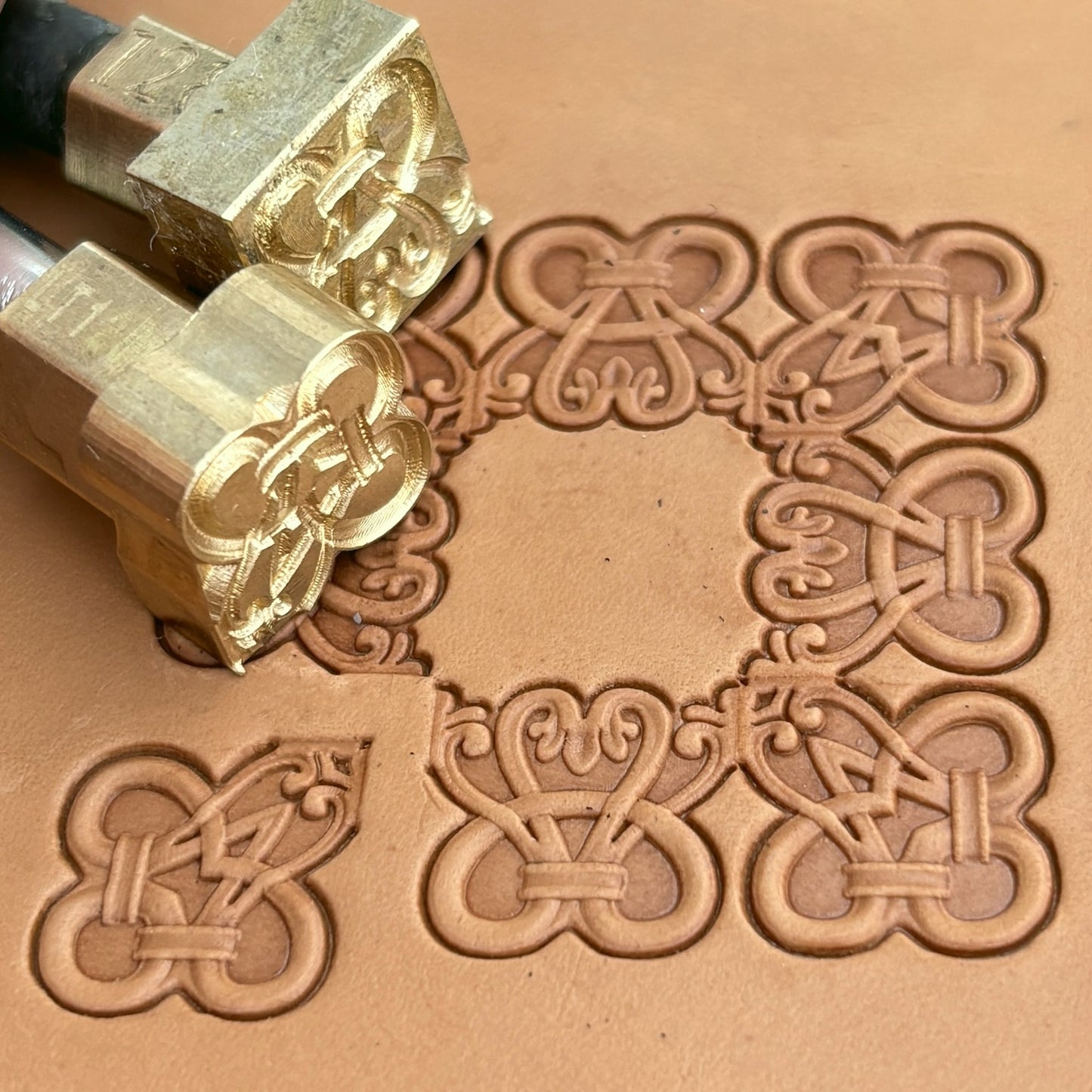Geometric leather stamp LT128 — brass stamping tool with imprint on natural veg-tan leather