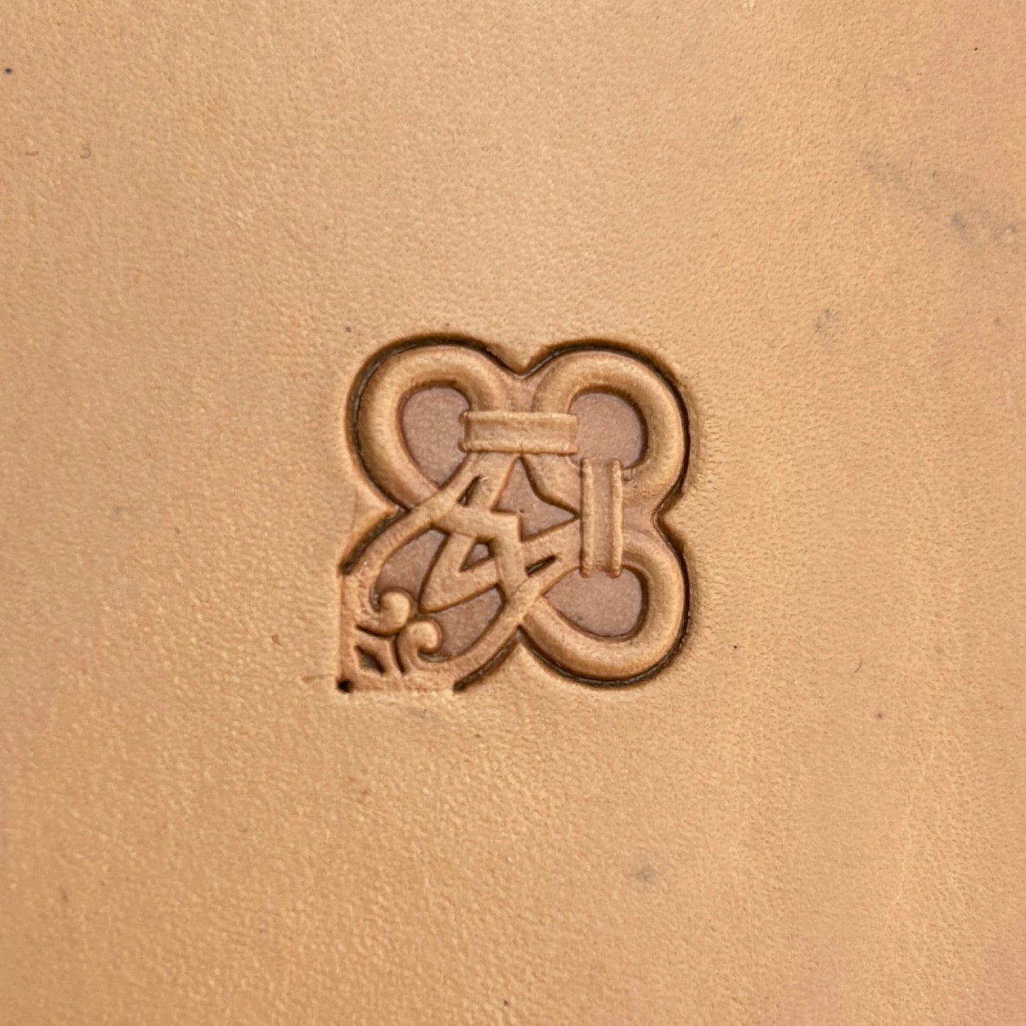 Geometric leather stamp LT128 — single impression on veg-tan leather