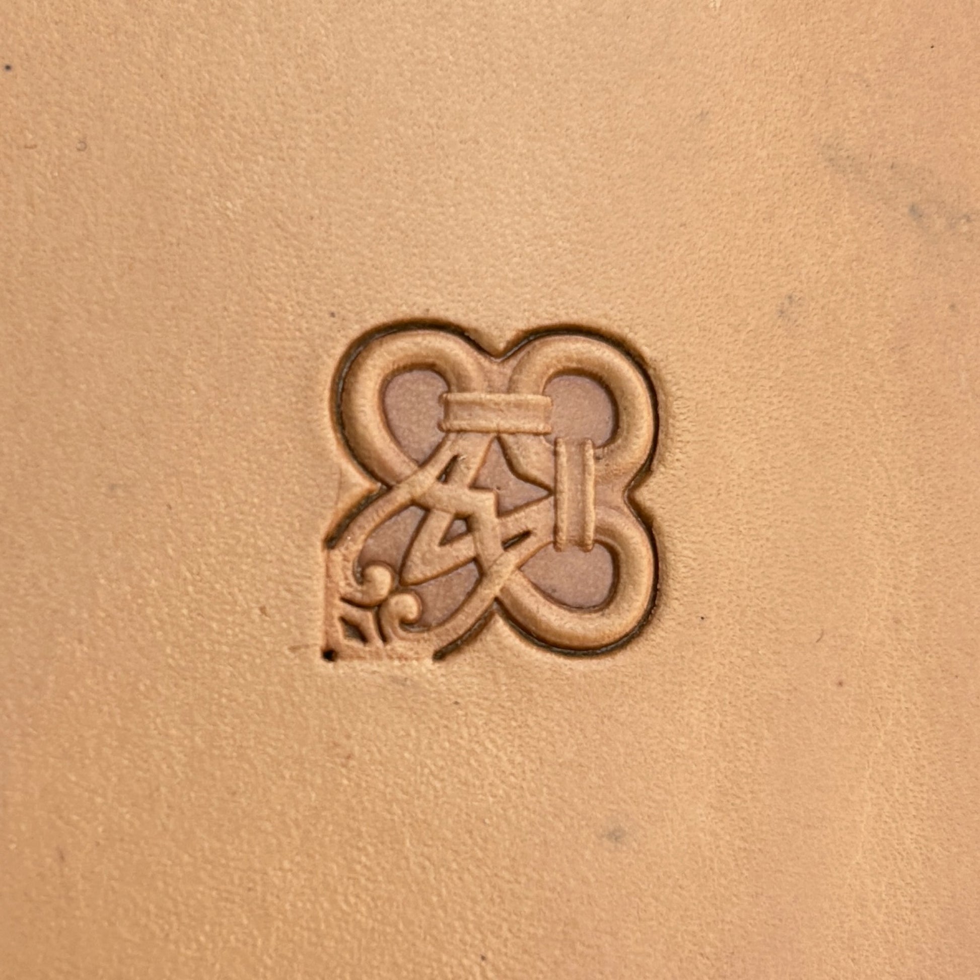 Geometric leather stamp LT128 — single impression on veg-tan leather