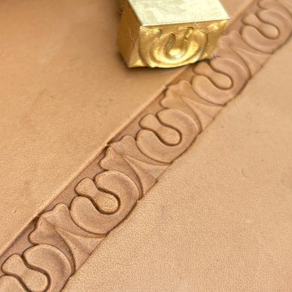 Ornate leather stamp LT129 — brass stamping tool with imprint on natural veg-tan leather