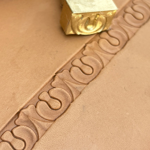 Ornate leather stamp LT129 — brass stamping tool with imprint on natural veg-tan leather