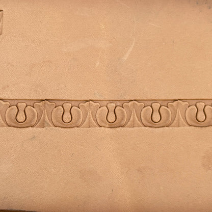 Ornate leather stamp LT129 — single impression on veg-tan leather