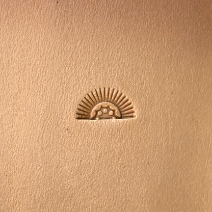 Sunrise leather stamp LT133 — single impression on veg-tan leather