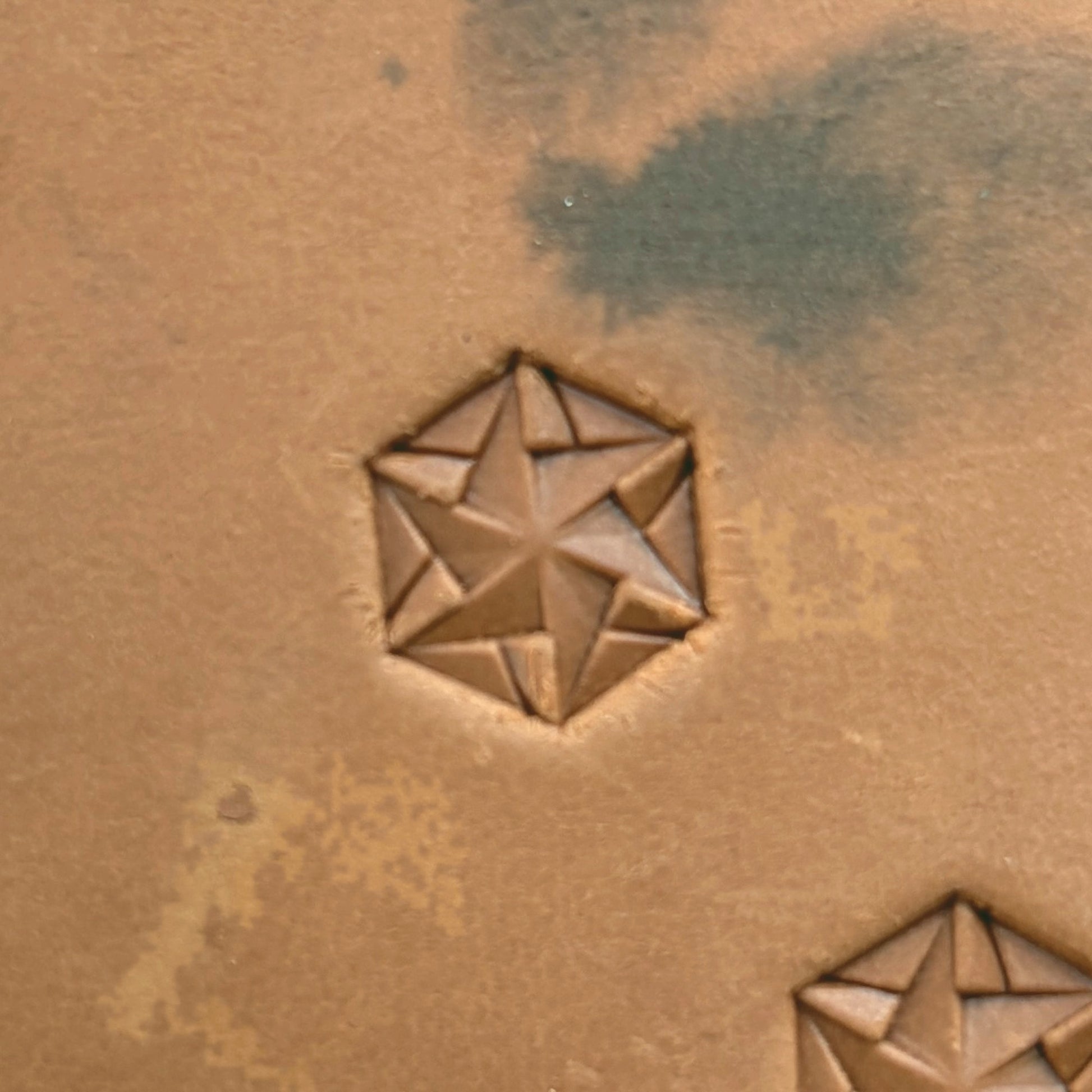 Star Mosaic Geometric leather stamp LT135 — single impression on veg-tan leather