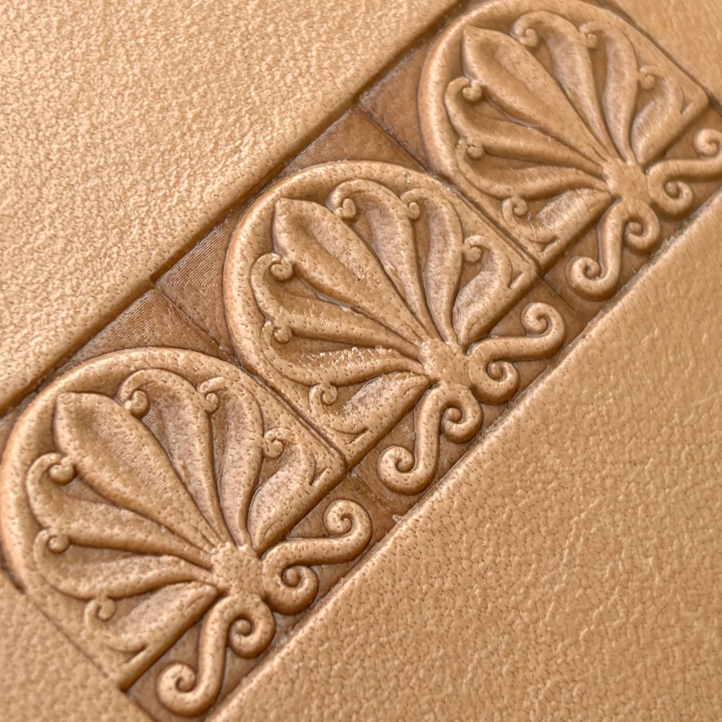Fleur leather stamp LT136 — imprint on natural veg-tan leather