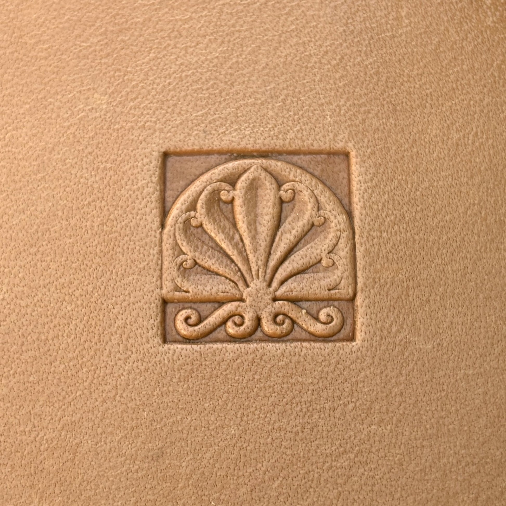 Fleur leather stamp LT136 — single impression on veg-tan leather