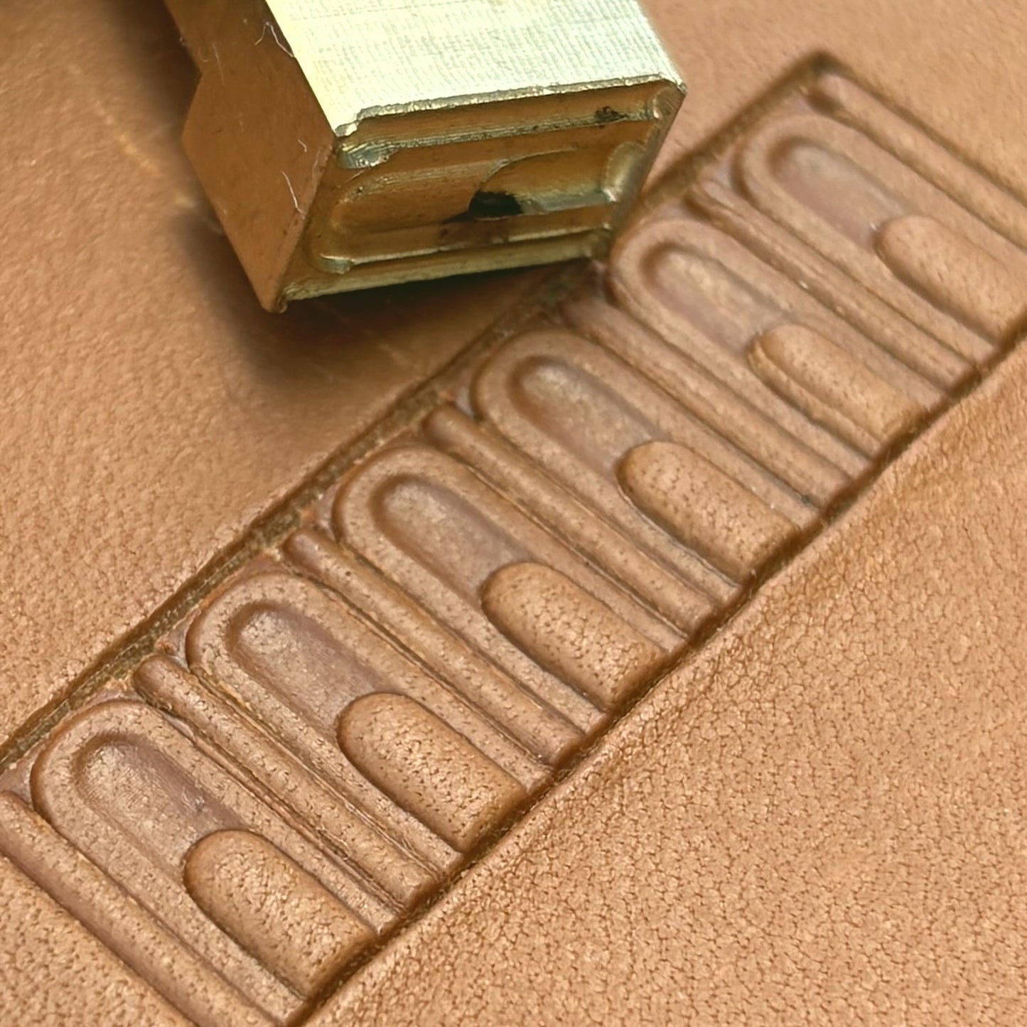 Arch Border Geometric leather stamp LT137 — brass stamping tool with imprint on natural veg-tan leather