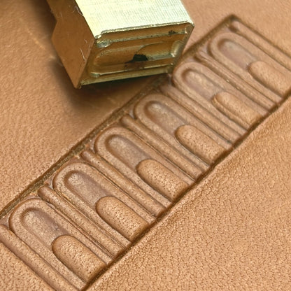 Arch Border Geometric leather stamp LT137 — brass stamping tool with imprint on natural veg-tan leather