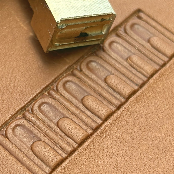 Arch Border Geometric leather stamp LT137 — brass stamping tool with imprint on natural veg-tan leather