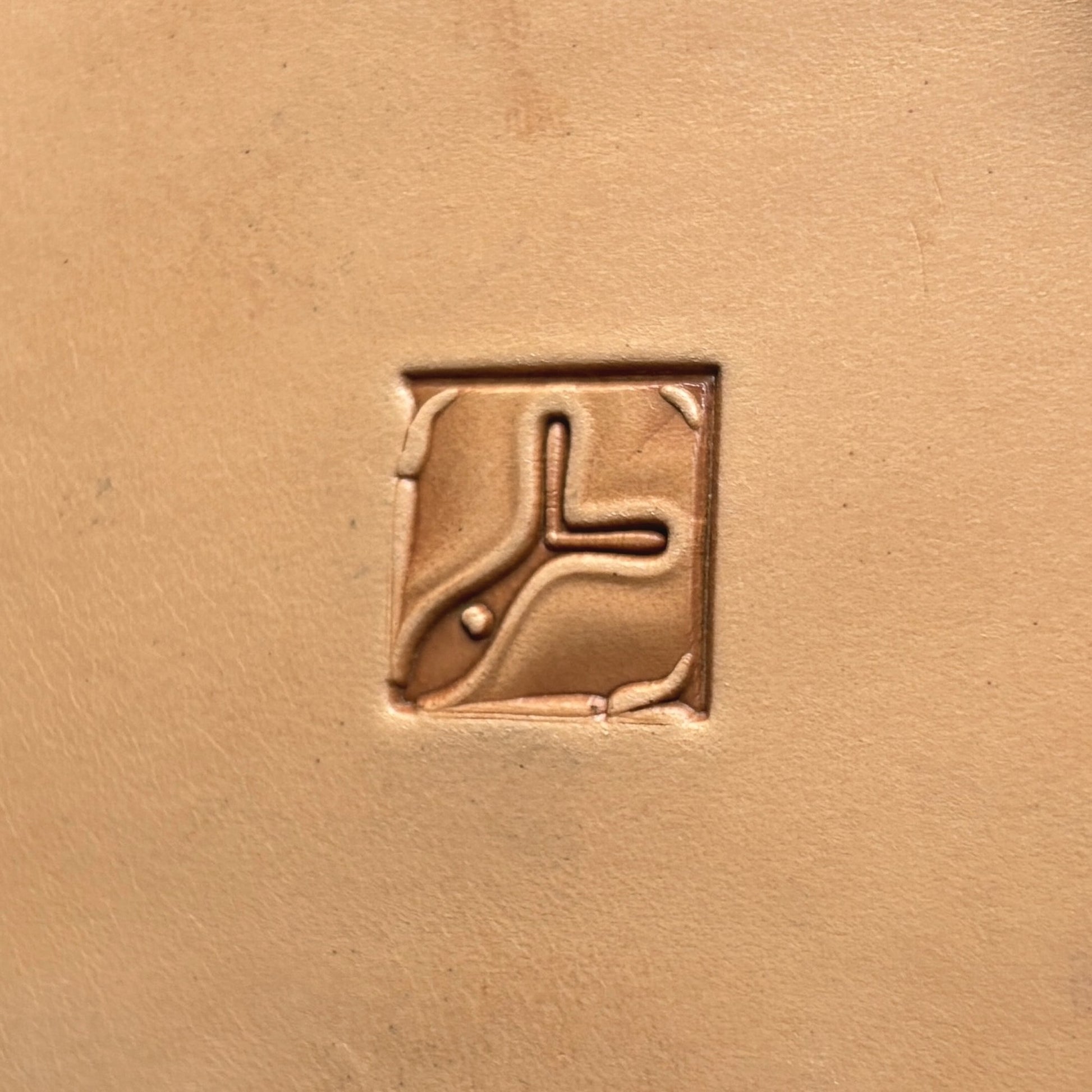 Ornate Tile leather stamp LT139 — single impression on veg-tan leather
