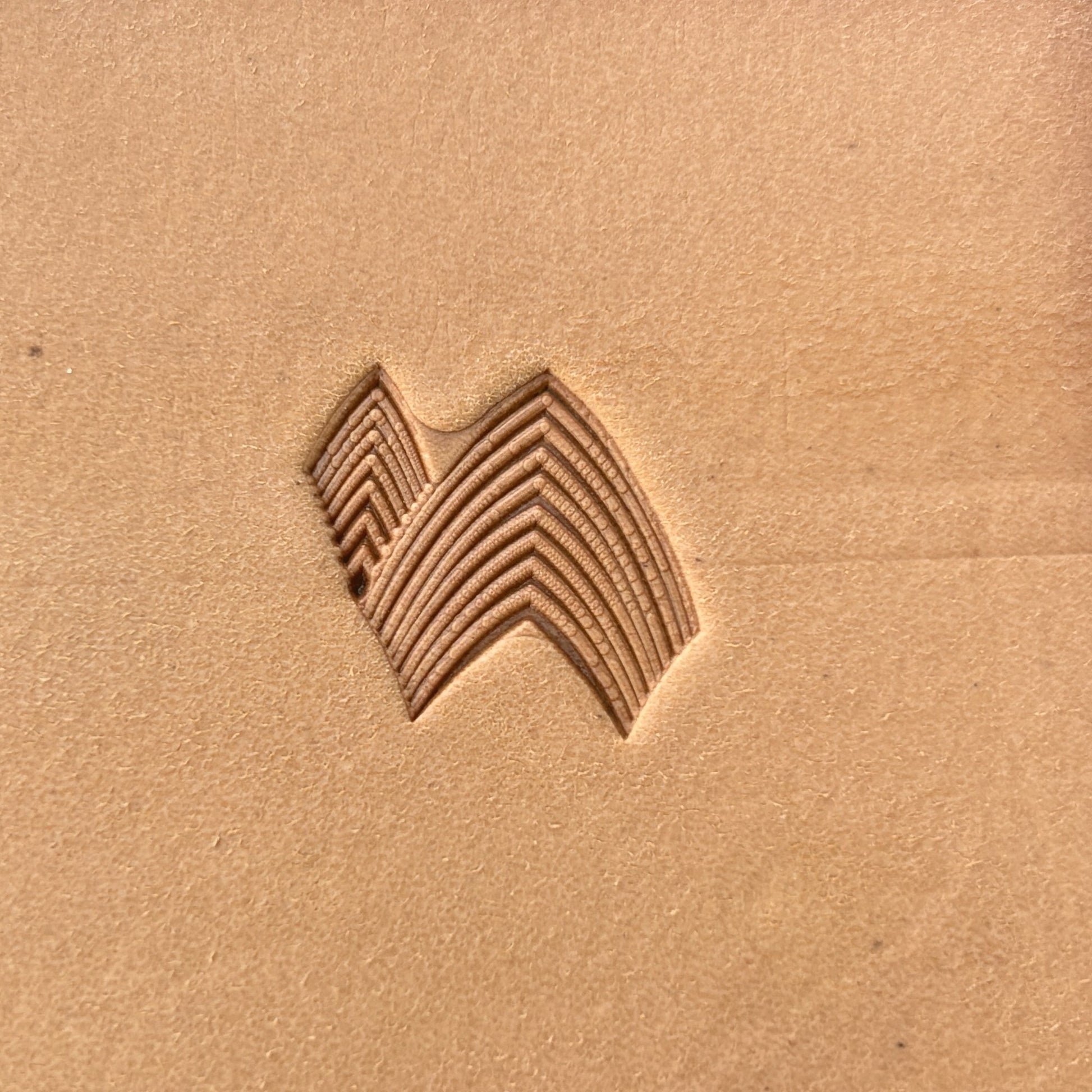 Layered Chevron Geometric leather stamp LT141 — single impression on veg-tan leather