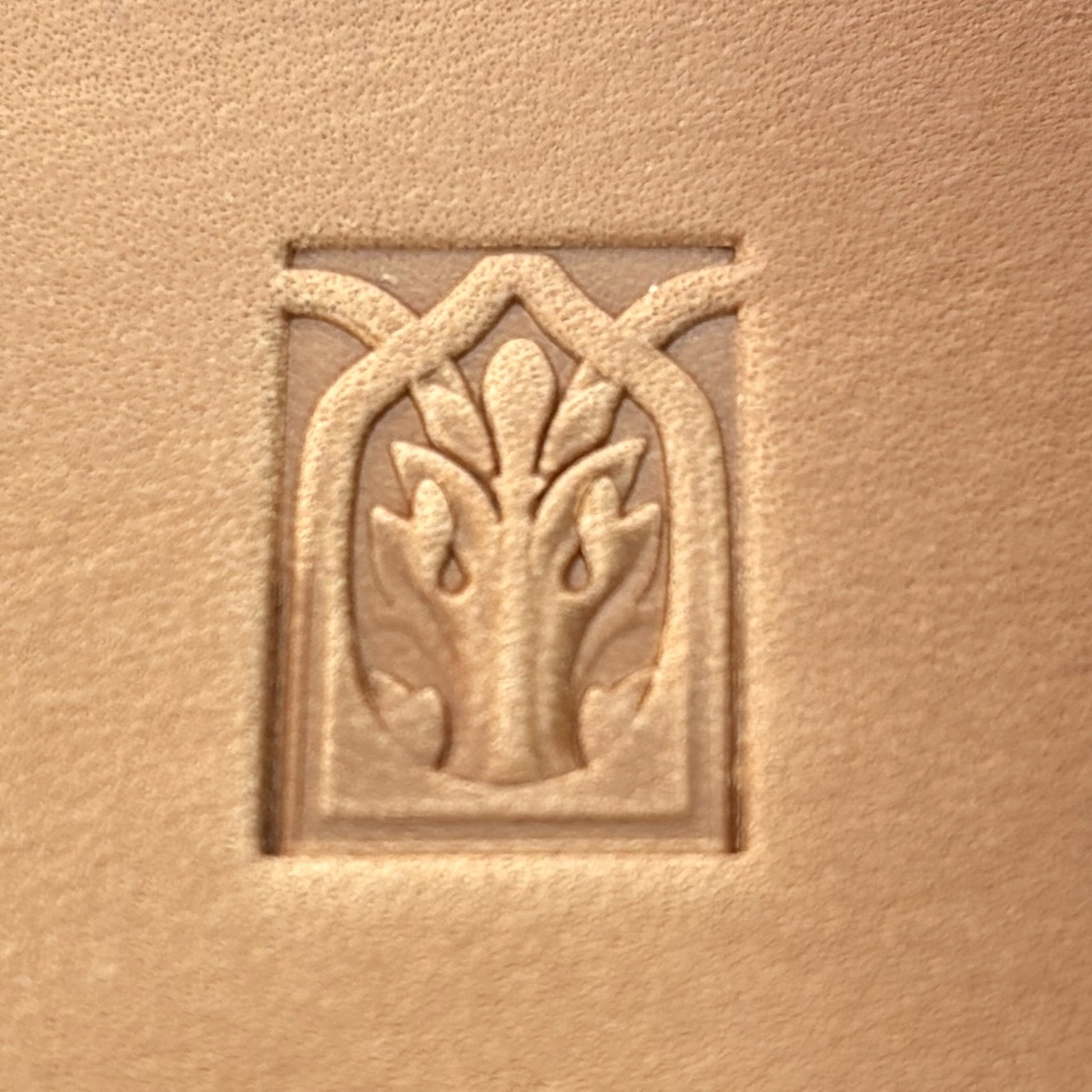 Gothic Arch Oak Leaf leather stamp LT142 — single impression on veg-tan leather
