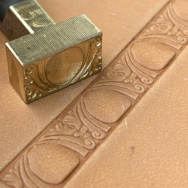 Art Deco leather stamp LT150 — brass stamping tool with imprint on natural veg-tan leather