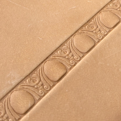 Art Deco leather stamp LT150 — single impression on veg-tan leather