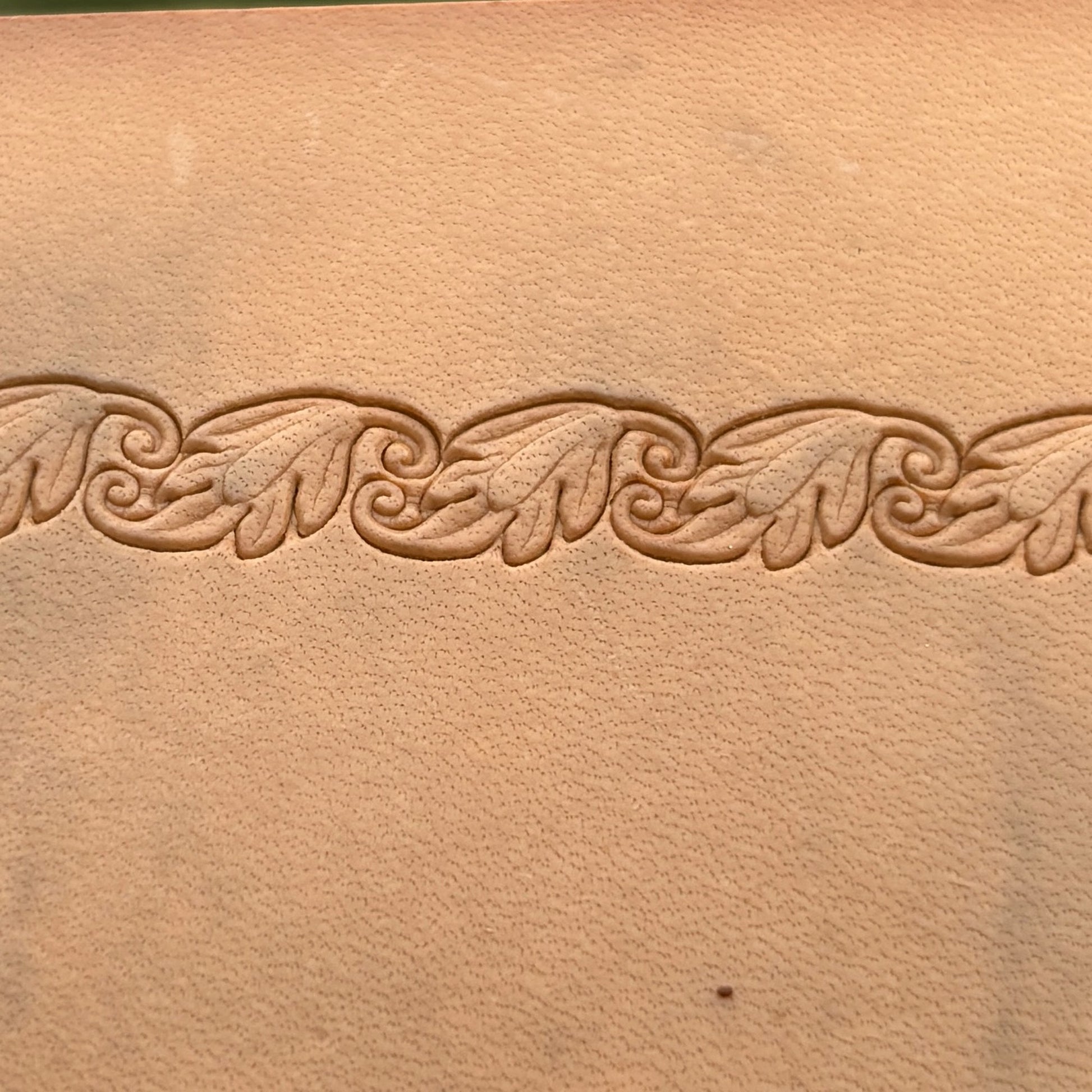 Embossed Vine Border leather stamp LT155 — single impression on veg-tan leather