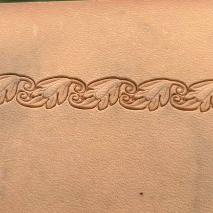 Embossed Vine Border leather stamp LT155 — single impression on veg-tan leather
