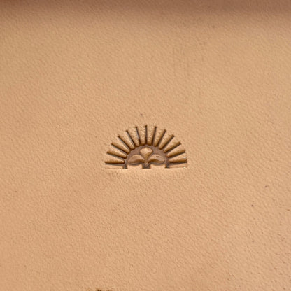 Sunburst Border leather stamp LT164 — single impression on veg-tan leather