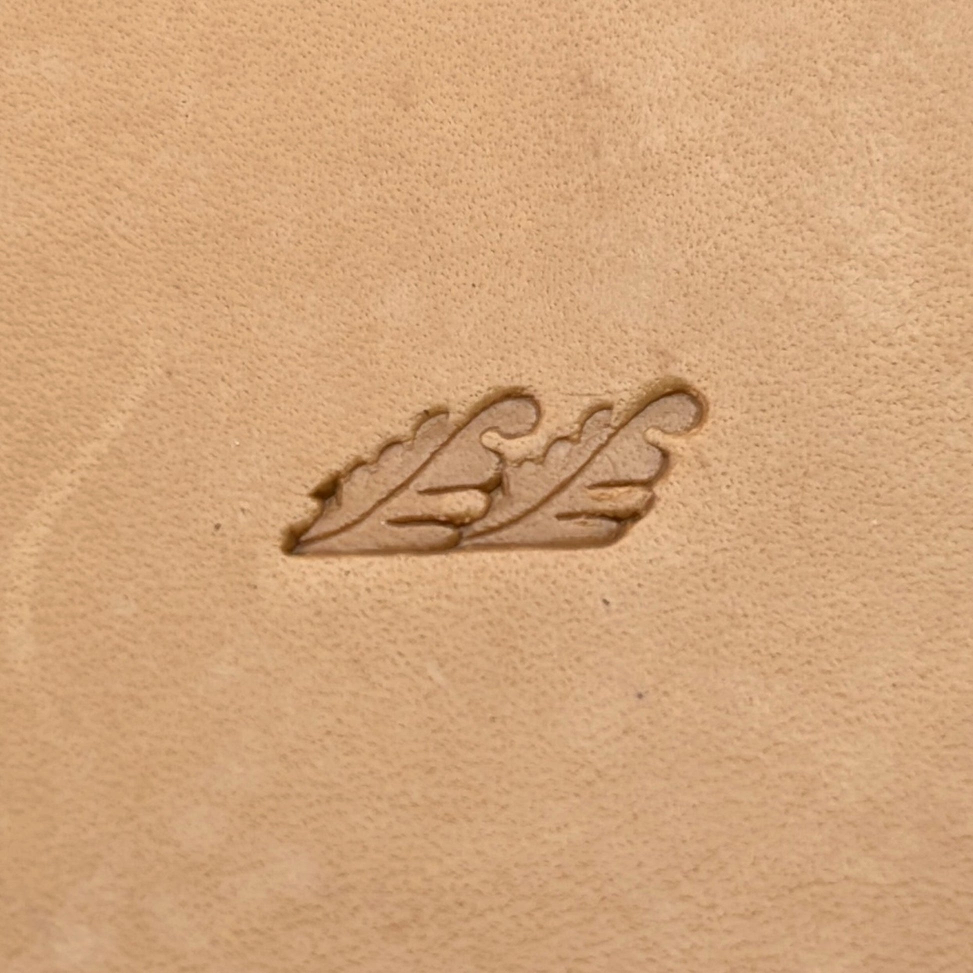 Border Trim Oak Leaf leather stamp LT168 — single impression on veg-tan leather