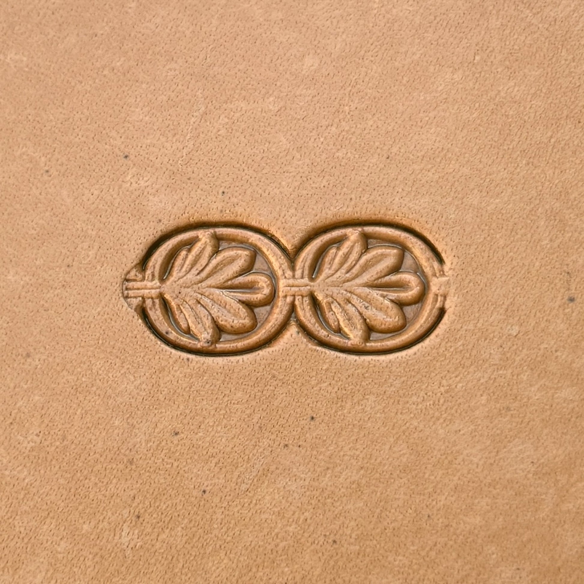 Double Oval 1 Leaf leather stamp LT170 — single impression on veg-tan leather