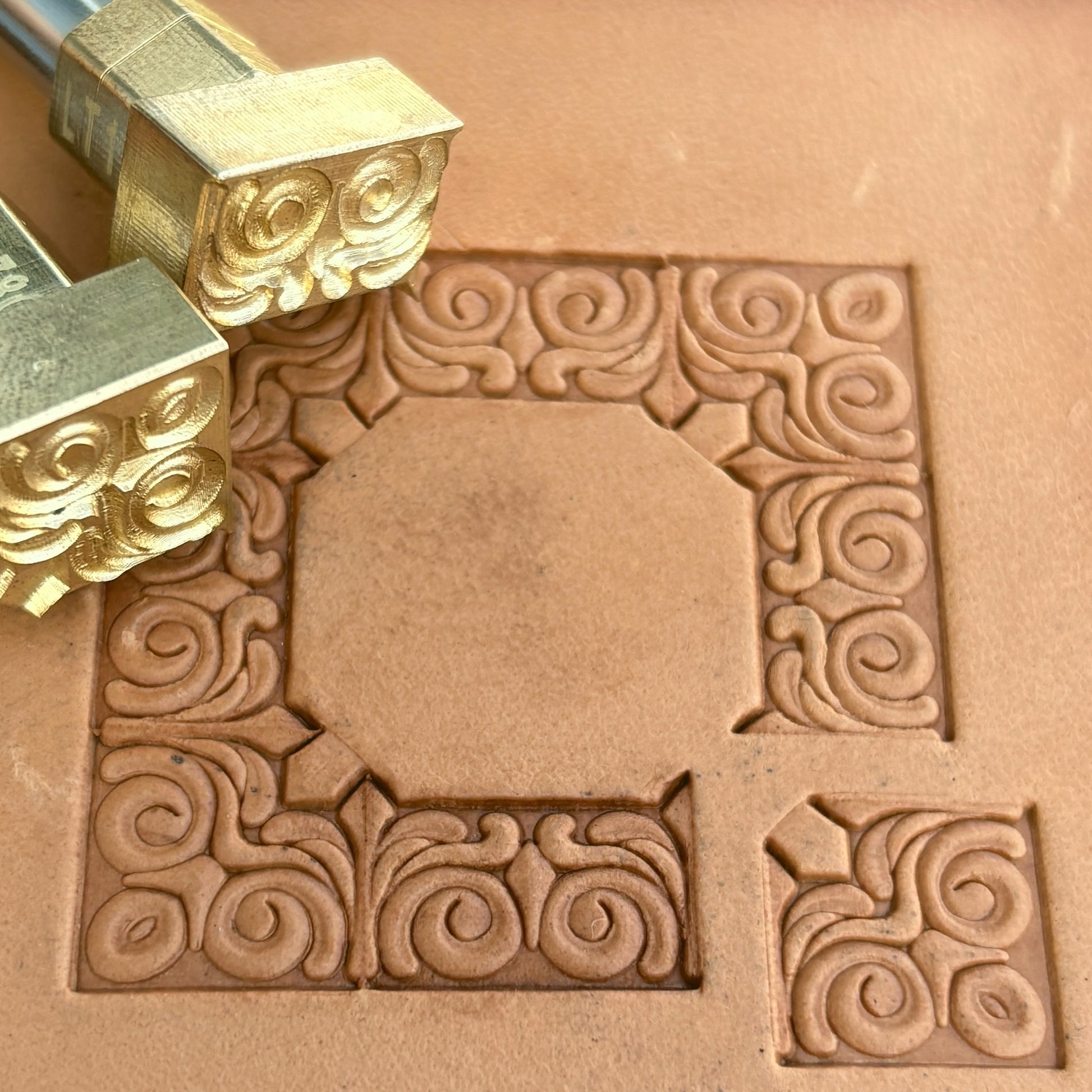 Swirl Border + Corner leather stamp LT178 — brass stamping tool with imprint on natural veg-tan leather