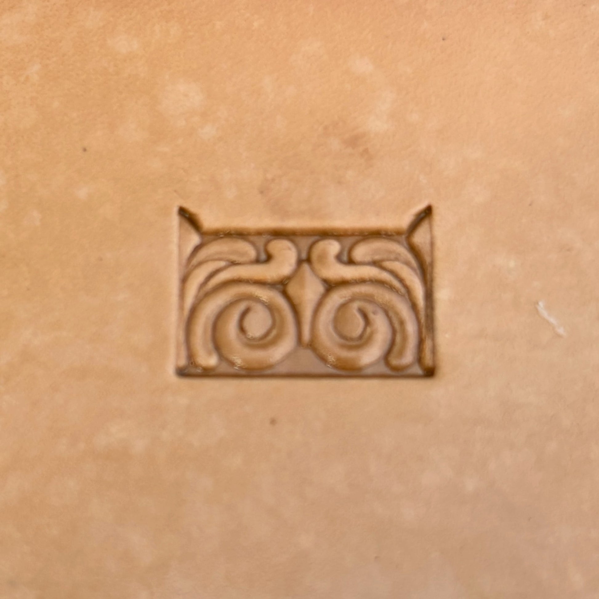 Swirl Border + Corner leather stamp LT178 — single impression on veg-tan leather