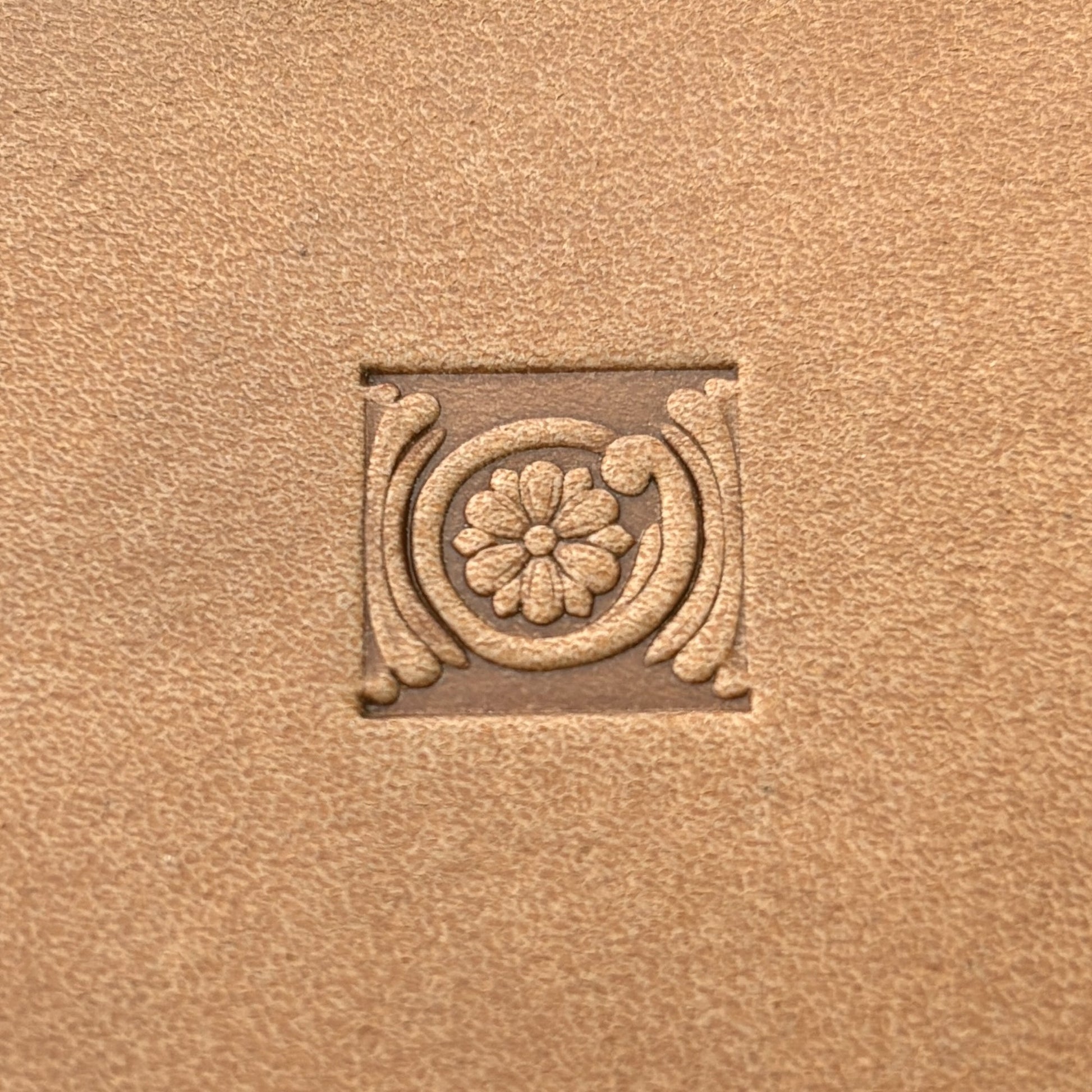 Circular Border Flower leather stamp LT179 — single impression on veg-tan leather