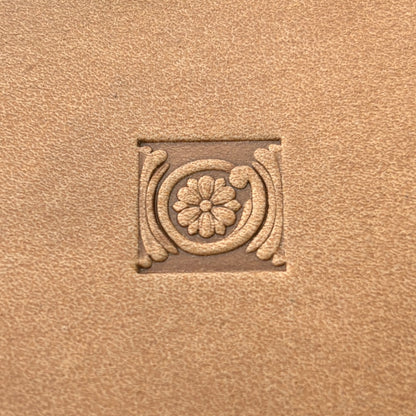 Circular Border Flower leather stamp LT179 — single impression on veg-tan leather