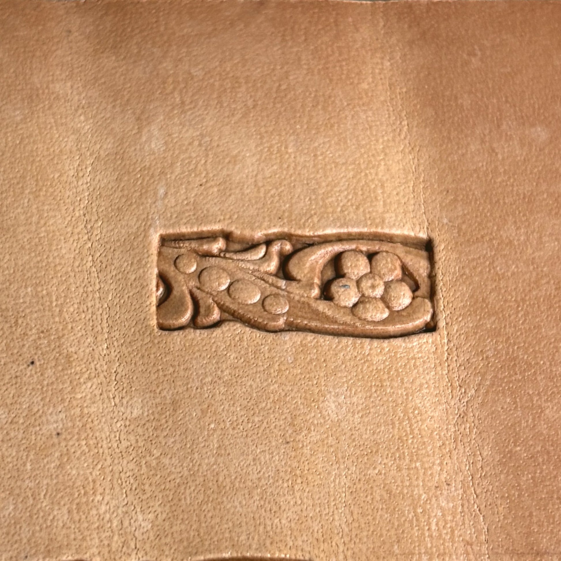 Flower leather stamp LT180 — single impression on veg-tan leather