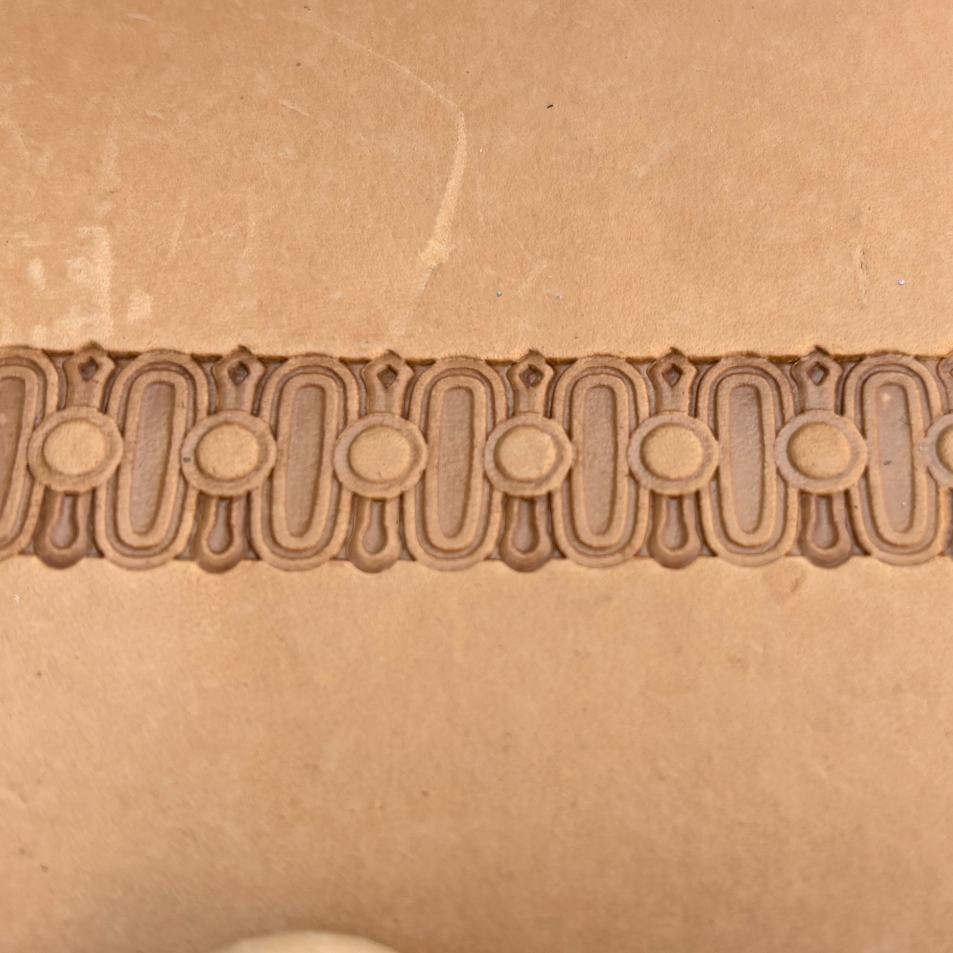 Oval Border leather stamp LT183 — pattern imprint on veg-tan leather