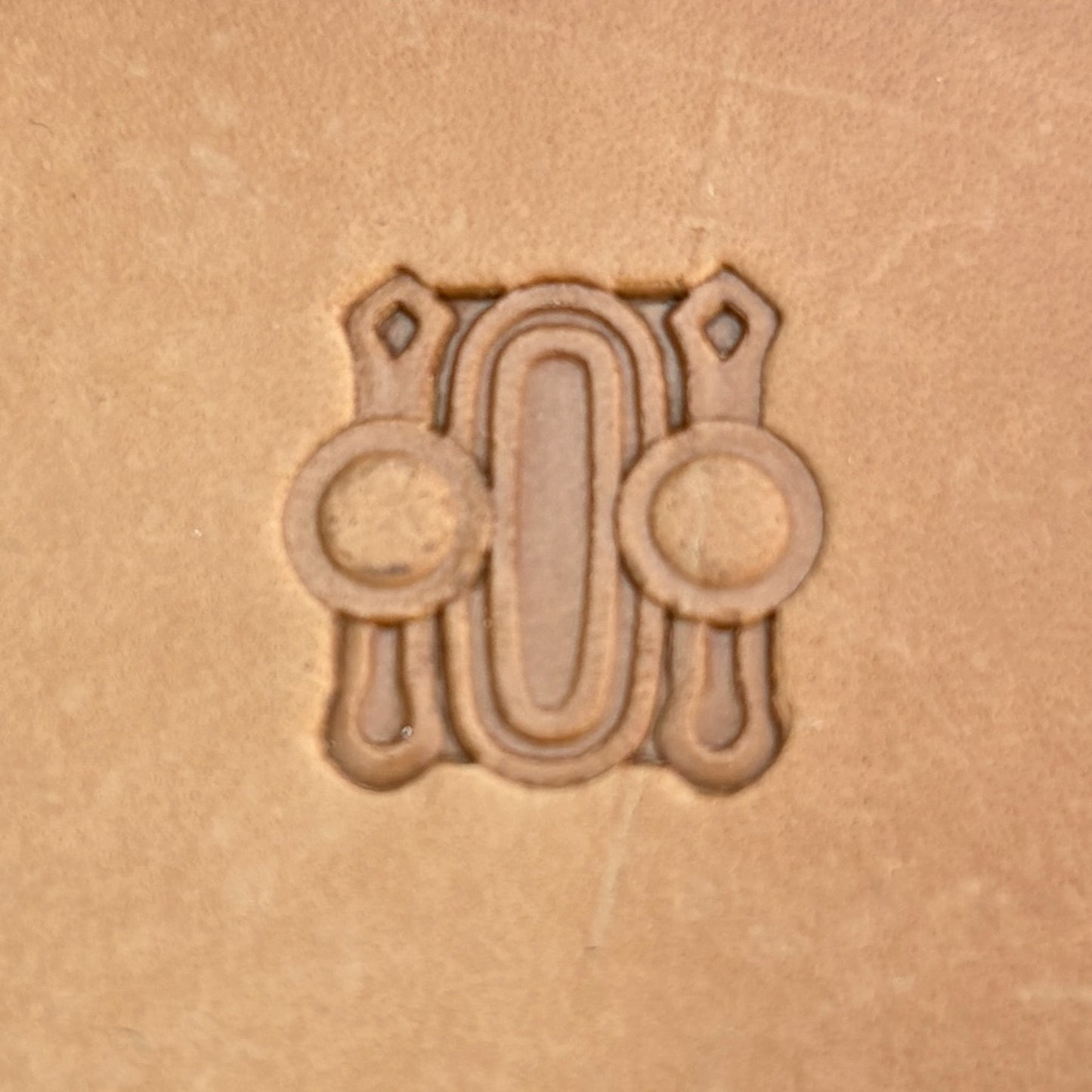 Oval Border leather stamp LT183 — single impression on veg-tan leather