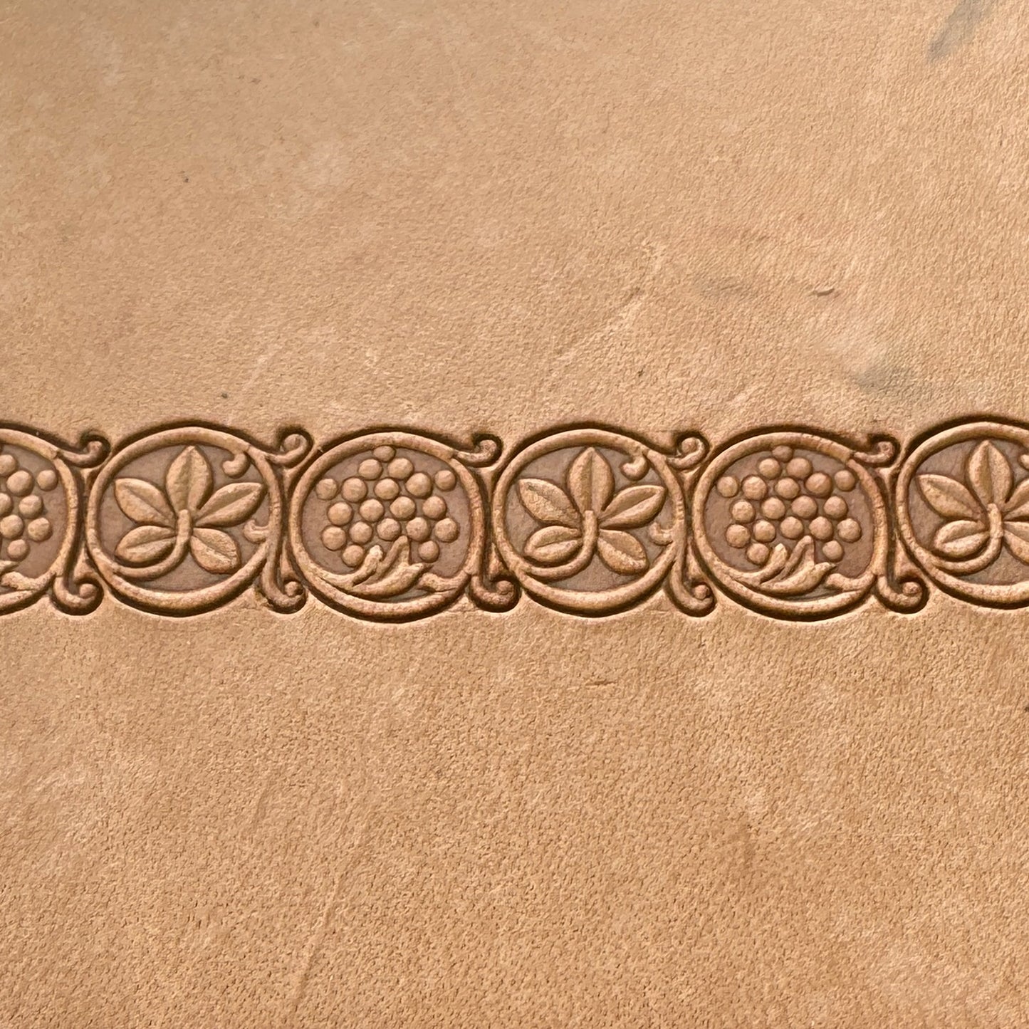 Grape Vine leather stamp LT184AB — repeating grape vine border pattern stamped along the middle of veg-tan leather