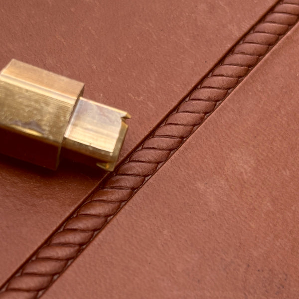 Rope Twist Border leather stamp LT190 — brass stamping tool with imprint on natural veg-tan leather