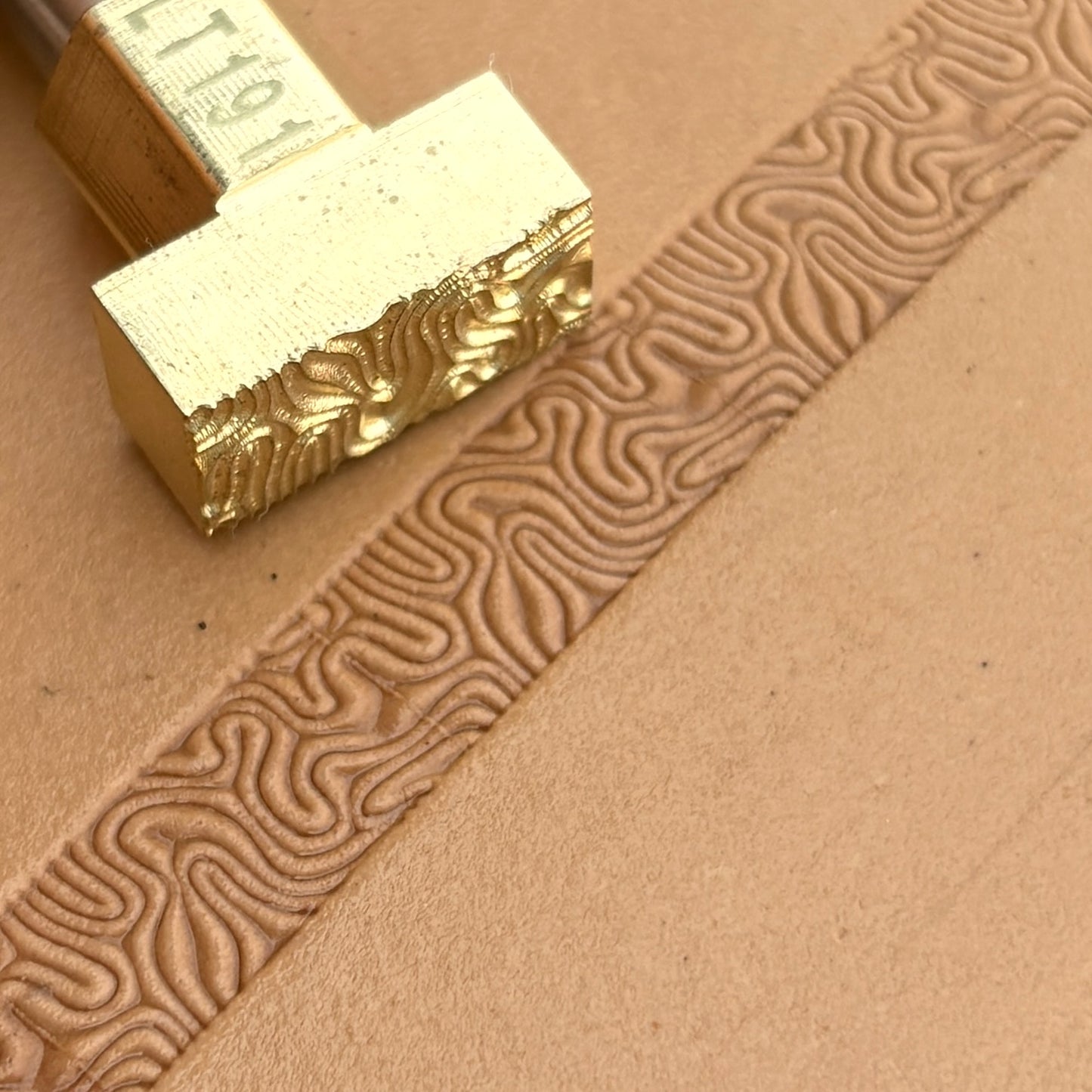 Maze Lines leather stamp LT191 — brass stamping tool with imprint on natural veg-tan leather