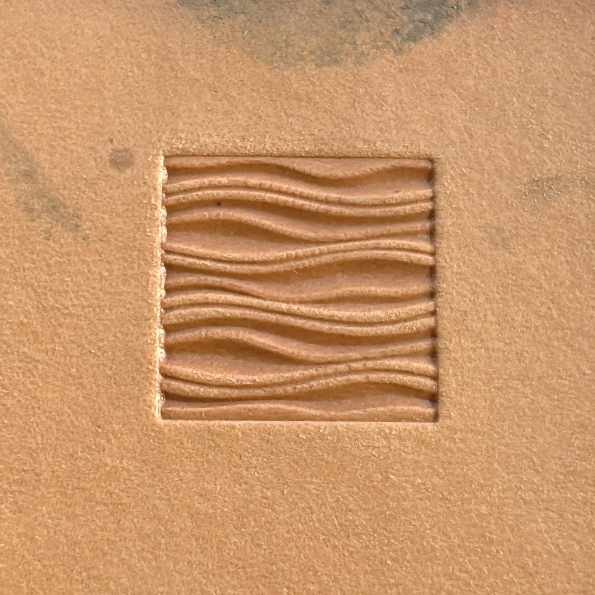 Wavy Lines leather stamp LT195 — single impression on veg-tan leather