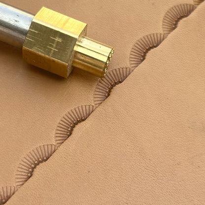 Radiant Curve Stitches leather stamp LT197 — brass stamping tool with imprint on natural veg-tan leather