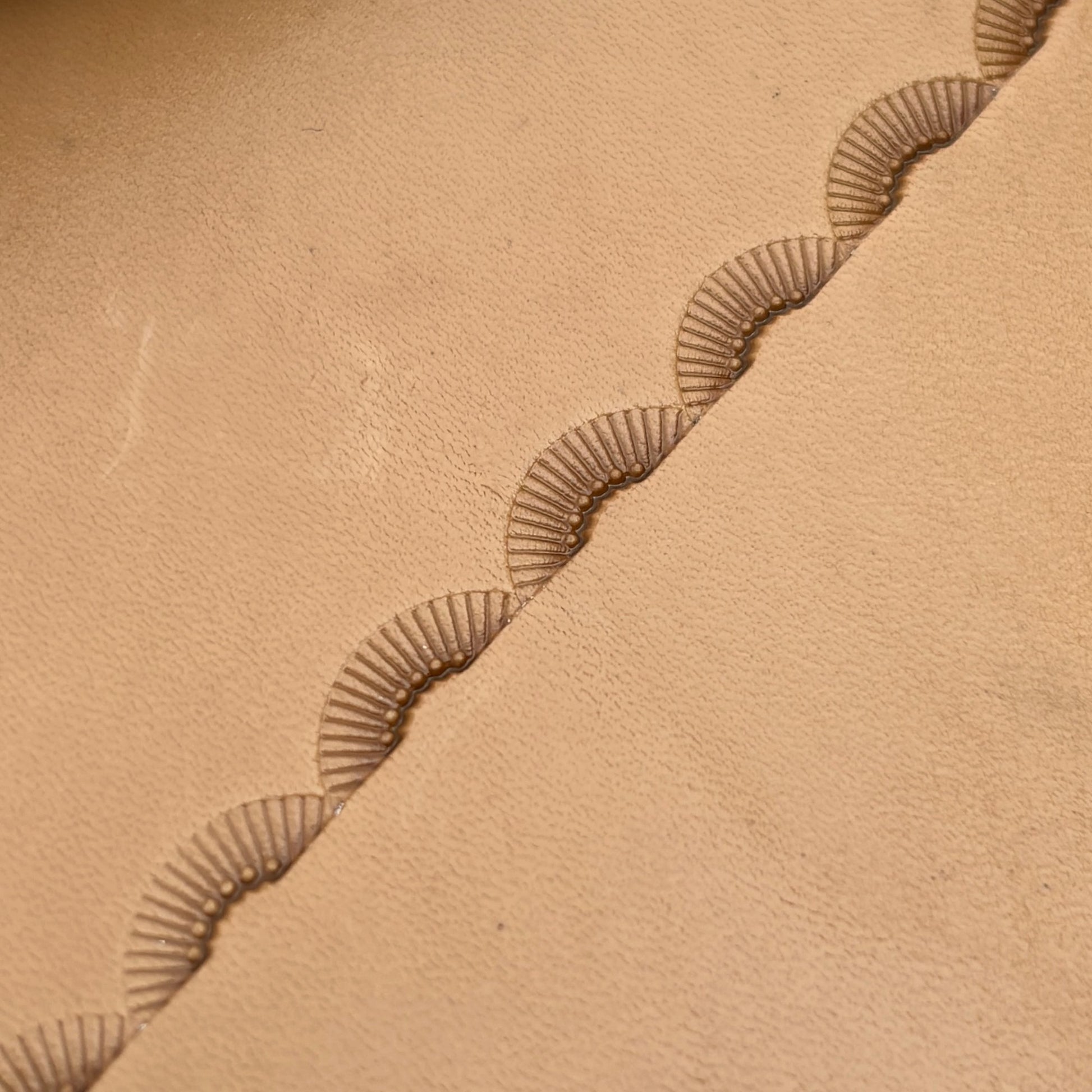Radiant Curve Stitches leather stamp LT197 — pattern imprint on veg-tan leather