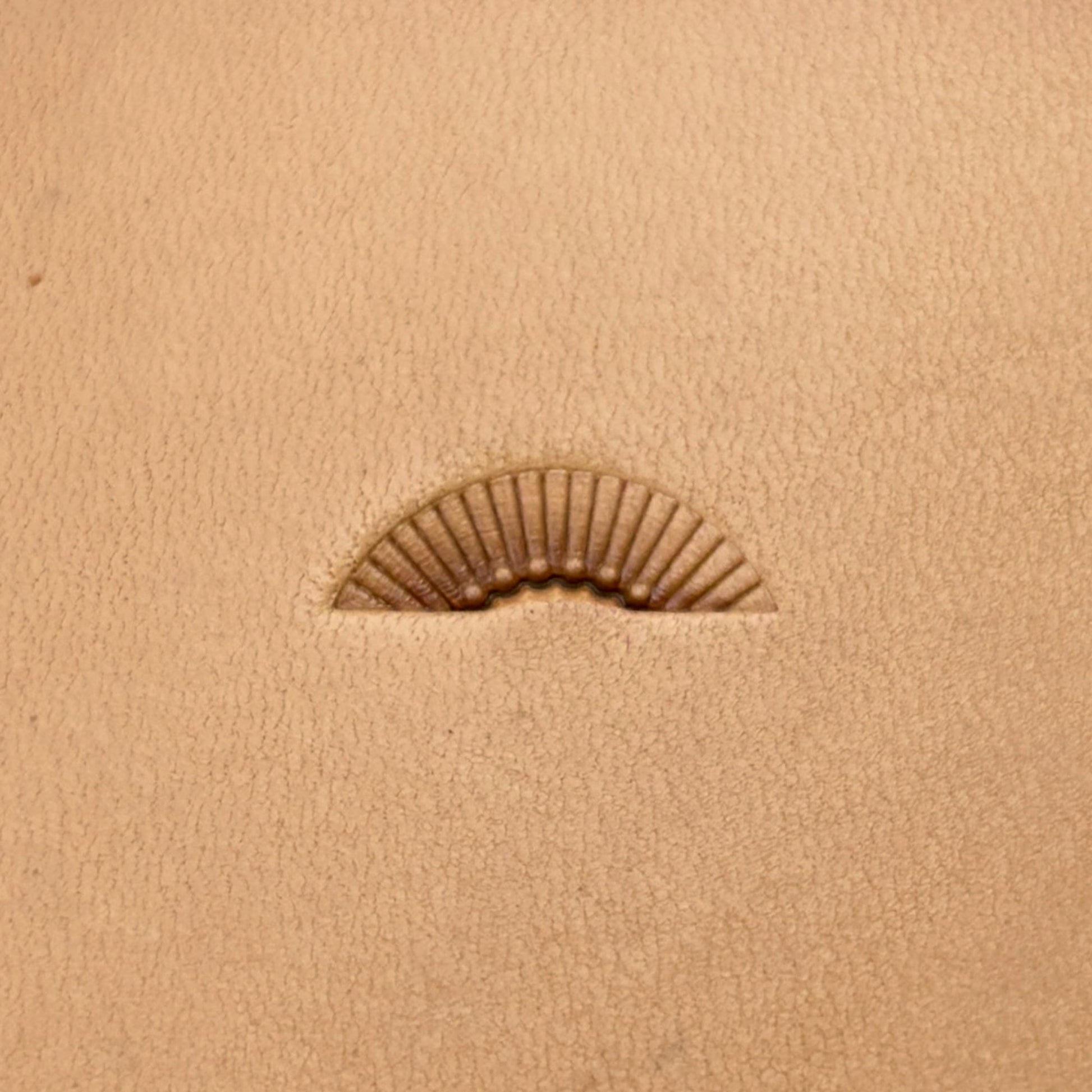 Radiant Curve Stitches leather stamp LT197 — single impression on veg-tan leather