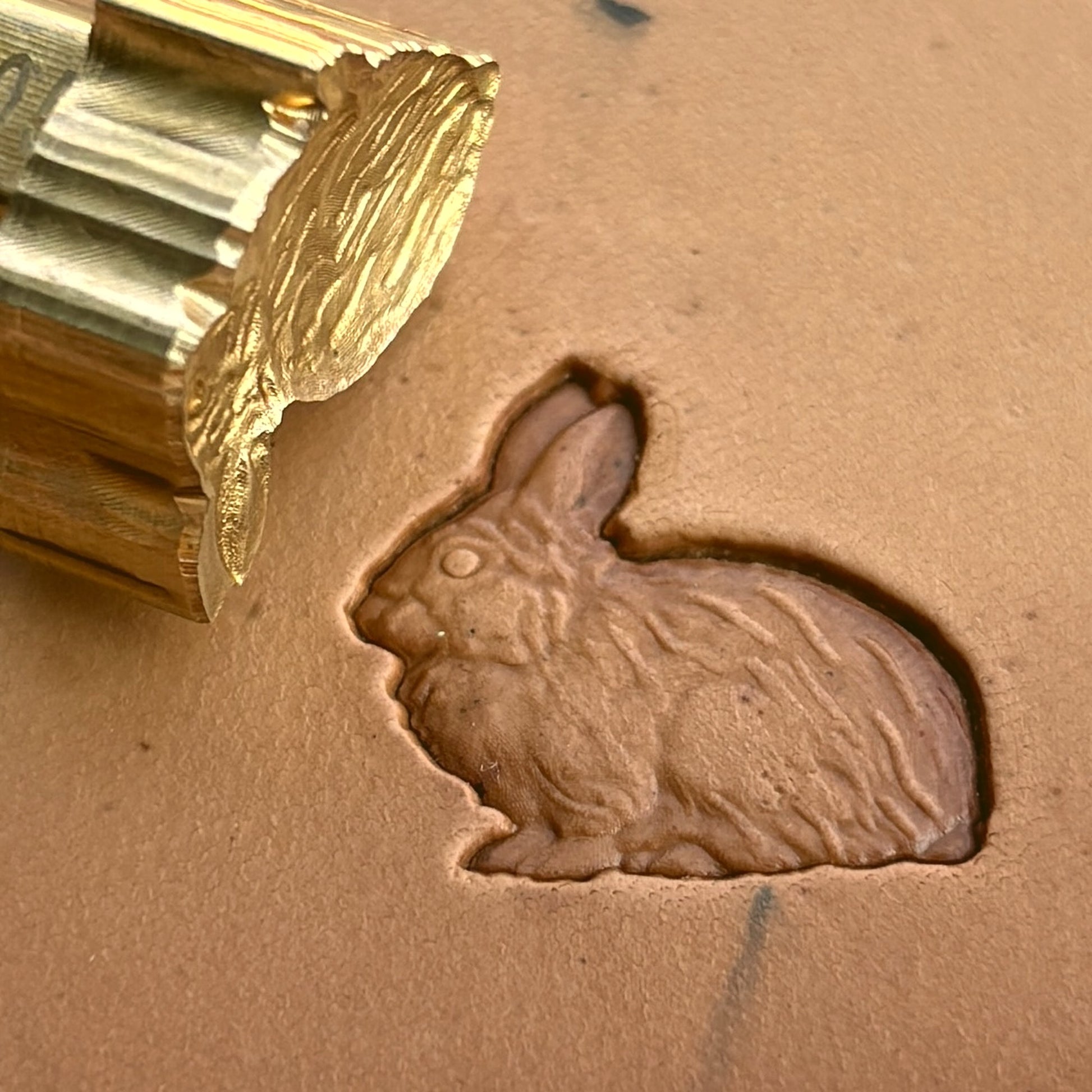 Rabbit leather stamp LT205 — brass stamping tool with imprint on natural veg-tan leather
